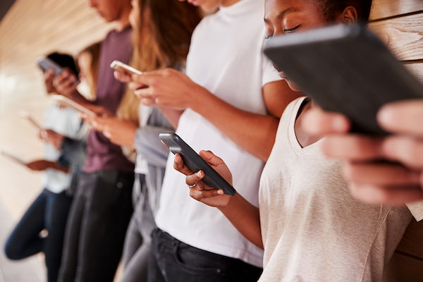 Teenagers using their phones